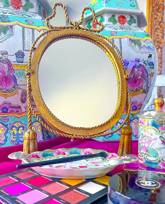 Vintage bow and tassel mirror